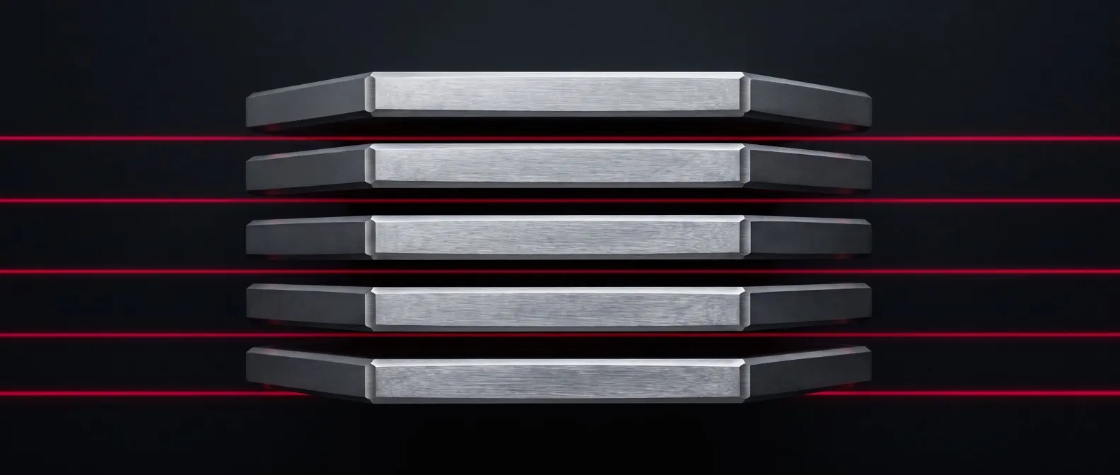 Five machined steel plates held apart in an exploded stack, with a thin red light line running through each gap.
