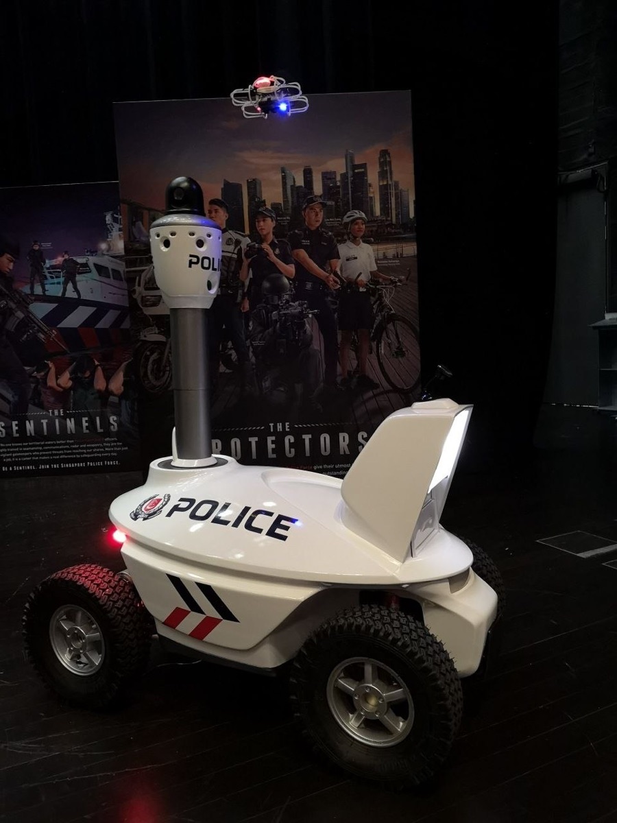 The S5 robot and a companion drone staged in front of Singapore Police Force recruitment campaign backdrops at the Police Workplan Seminar 2018.