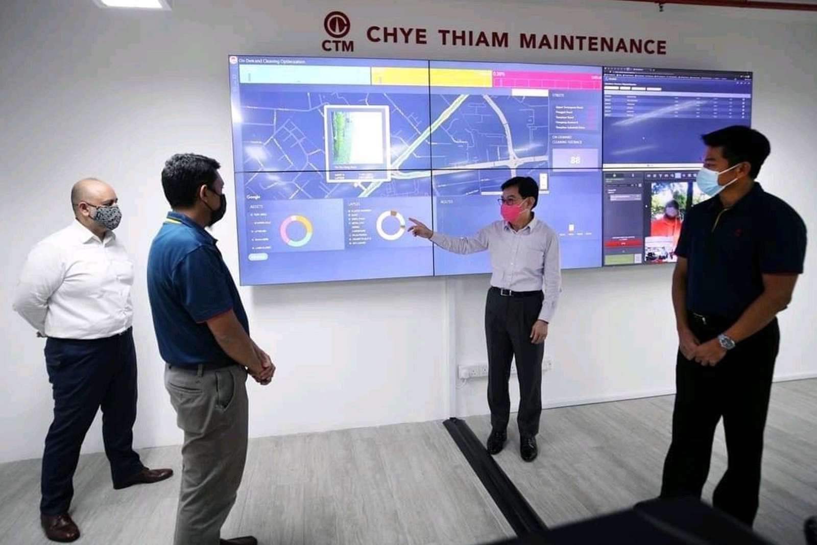 The Chye Thiam Maintenance command centre, its video wall carrying live cleaning route optimisation, asset dashboards, and body camera feeds, during a site visit.