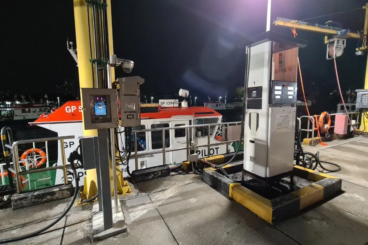 A PSA Marine pilot craft alongside the instrumented bunkering point, showing the fuel dispenser and the facial recognition terminal.